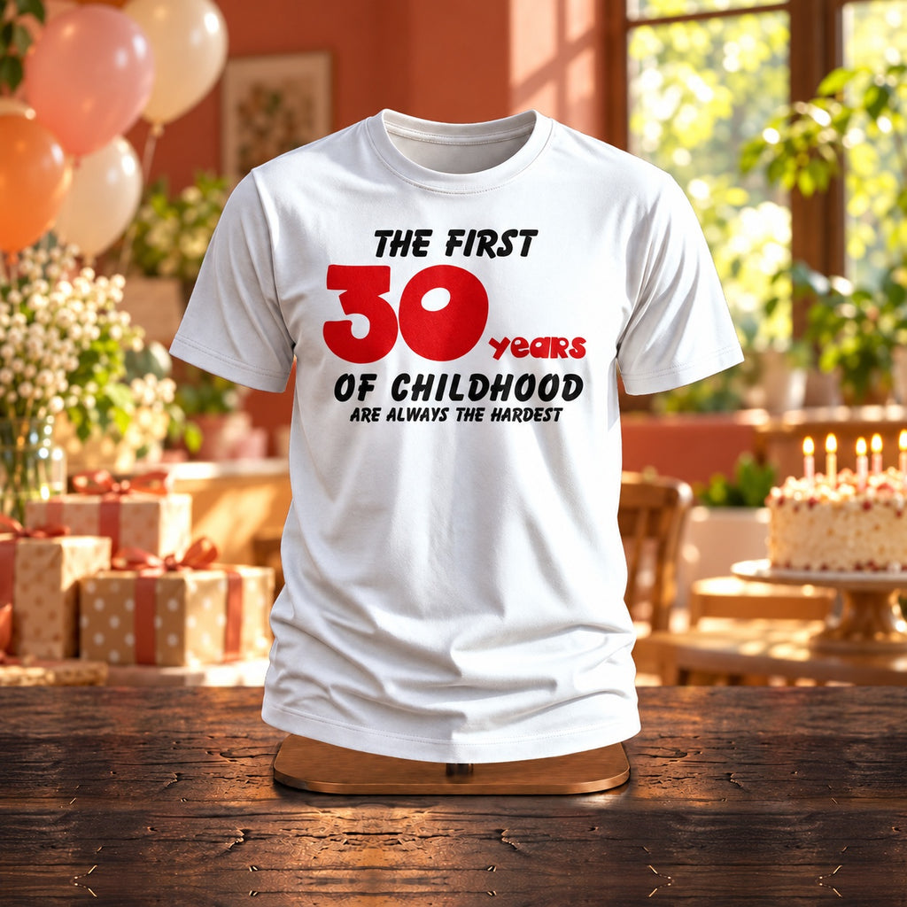 The First 30 Years of Childhood T-shirt in white with a red 30 on a wooden stand at a birthday party with balloons, cake and gifts - funny 30th birthday gift