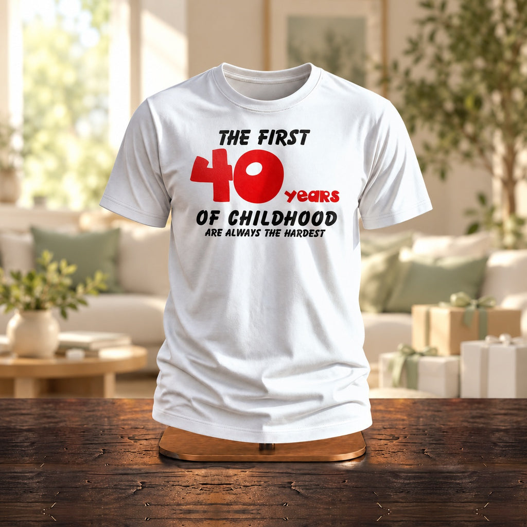 The First 40 Years of Childhood T-shirt in white with a red 40 on a wooden stand in a bright living room with gifts - funny 40th birthday gift
