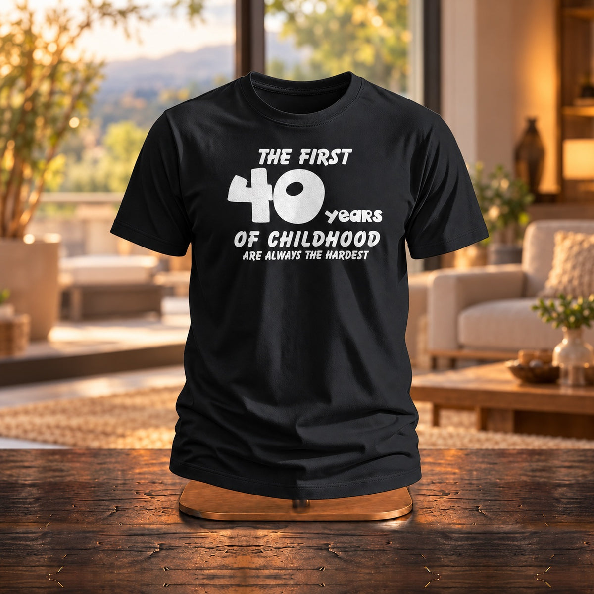 The First 40 Years of Childhood T-shirt in black on a wooden stand in a bright living room - funny 40th birthday gift