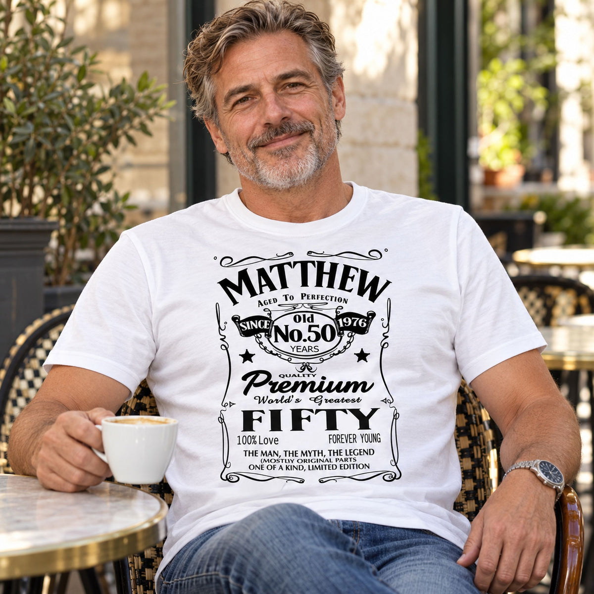 Matthew wearing a white personalised 50th birthday T-shirt with name, 50 years and 1976 - custom gift for him