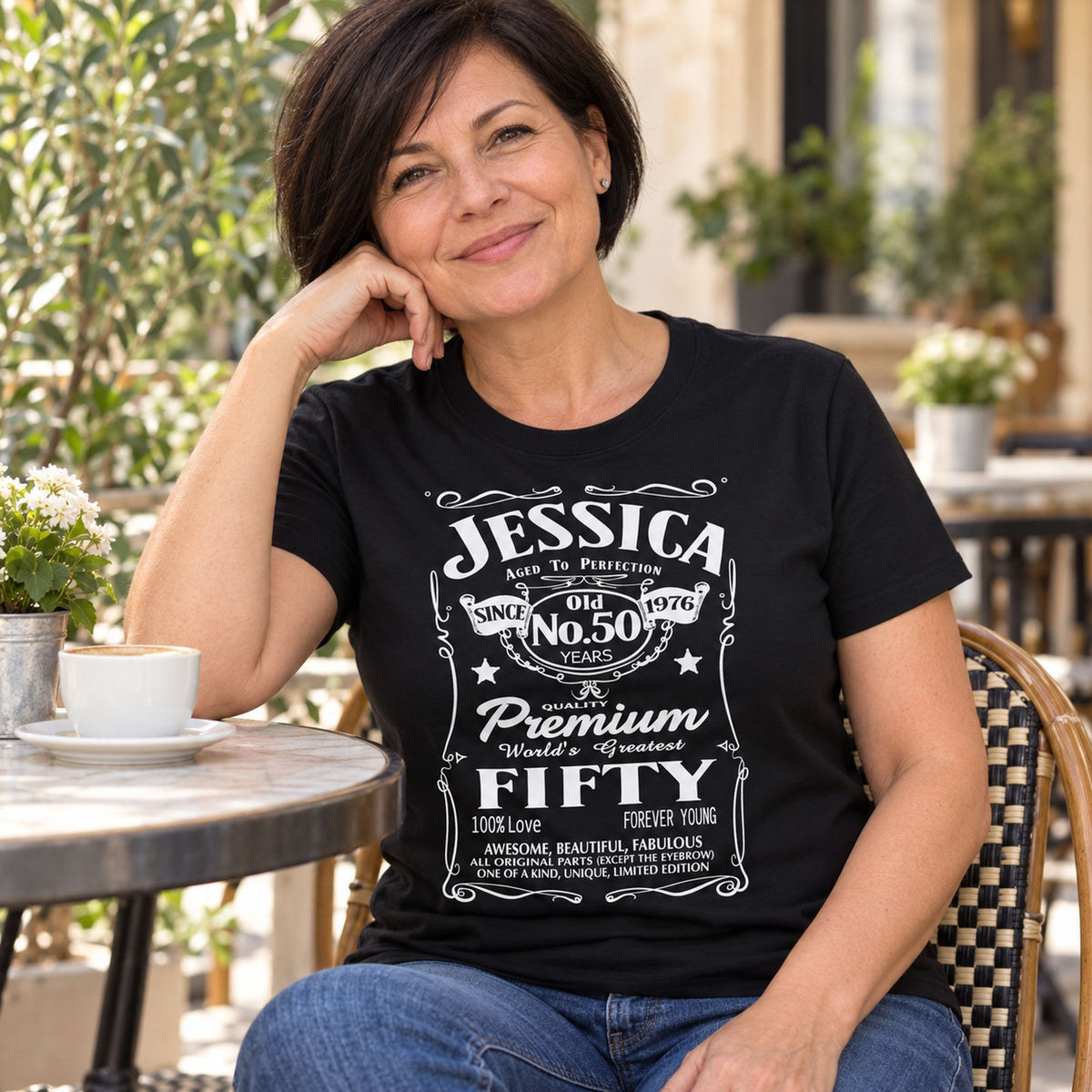 Jessica wearing a black personalised 50th birthday T-shirt with name, 50 years and 1976 - custom gift for her