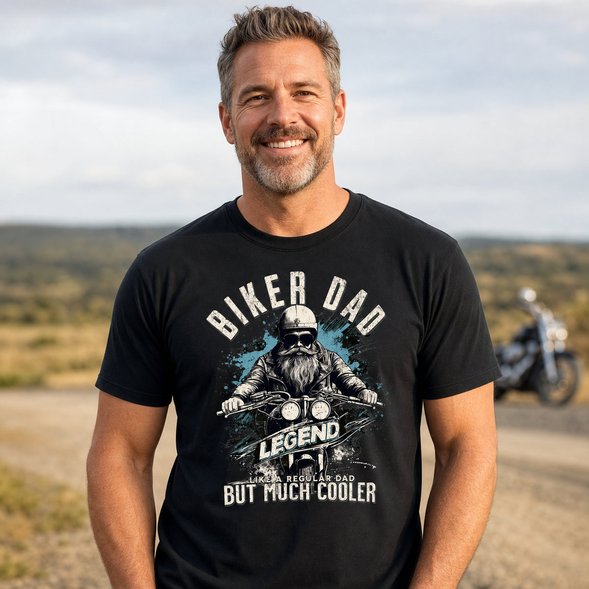 Biker Dad Legend t-shirt in black - smiling man on a country road with a motorcycle behind, gift for a biker dad