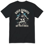 Black Biker Grandpa Legend T-Shirt t-shirt - bearded biker in a helmet and sunglasses on a motorcycle, the word LEGEND and a blue paint splash, gift for grandpa