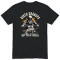 Black Biker Grandpa Legend Shirt t-shirt - bearded biker in a helmet and sunglasses on a motorcycle, the word LEGEND and a orange paint splash, gift for grandpa