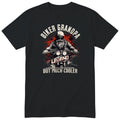 Black Biker Grandpa Legend t-shirt - bearded biker in a helmet and sunglasses on a motorcycle, the word LEGEND and a red paint splash, gift for grandpa