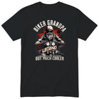 Black Biker Grandpa Legend t-shirt - bearded biker in a helmet and sunglasses on a motorcycle, the word LEGEND and a red paint splash, gift for grandpa