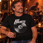 Blues Music Vinyl Records t-shirt in black - man with a glass of whisky in a bar while a guitarist plays live behind him, gift for blues fans