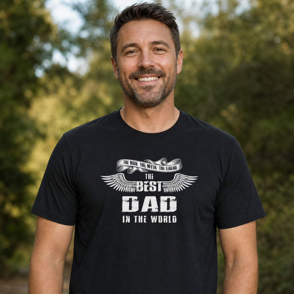 The Best Dad in the World wings t-shirt in black - smiling man in the garden, gift for dad