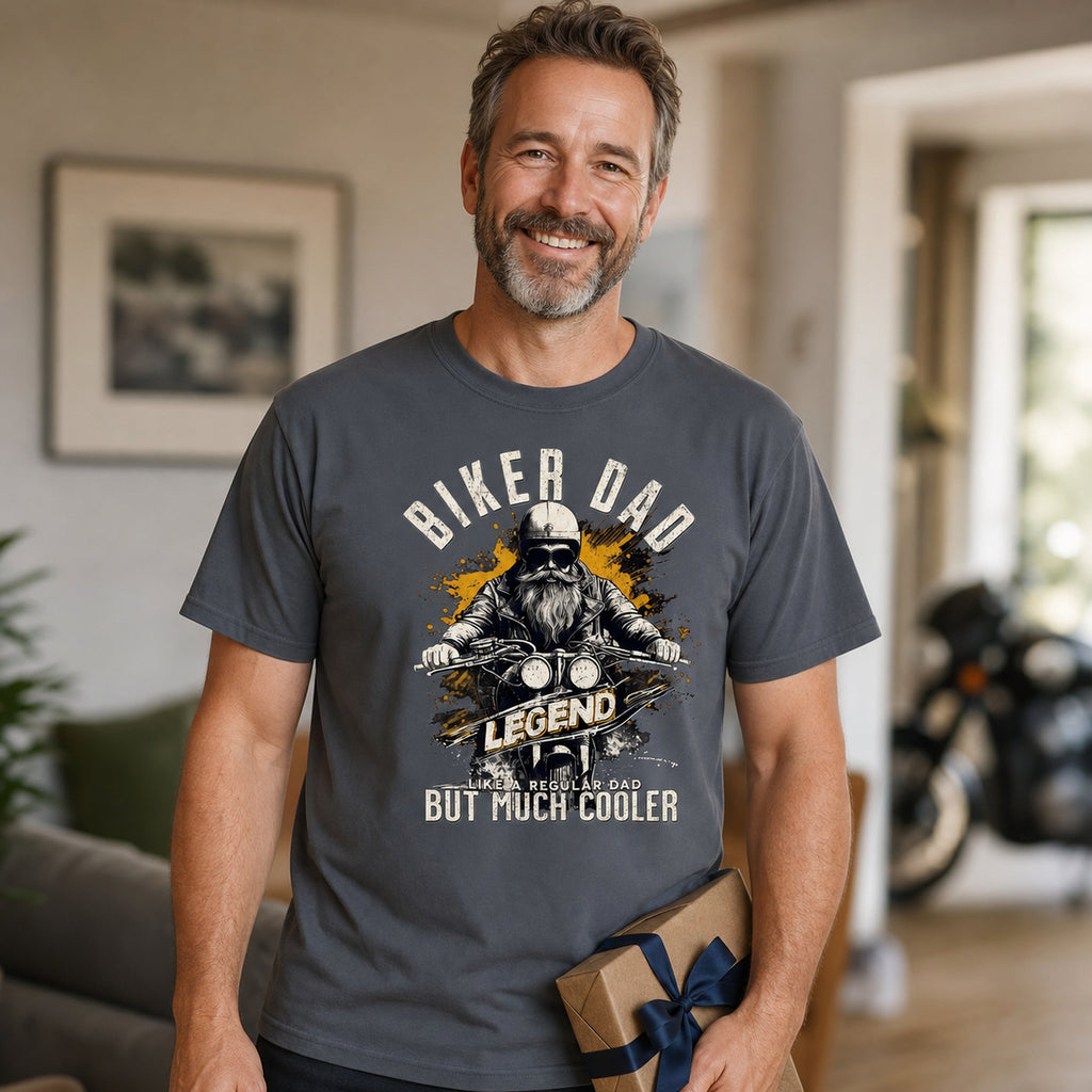 Biker Dad Legend t-shirt in charcoal - dad holding a present at home with a motorcycle in the background, Father's Day gift