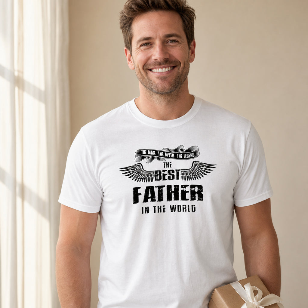 The Best Father in the World wings t-shirt in white - dad holding a present at home, Father's Day gift
