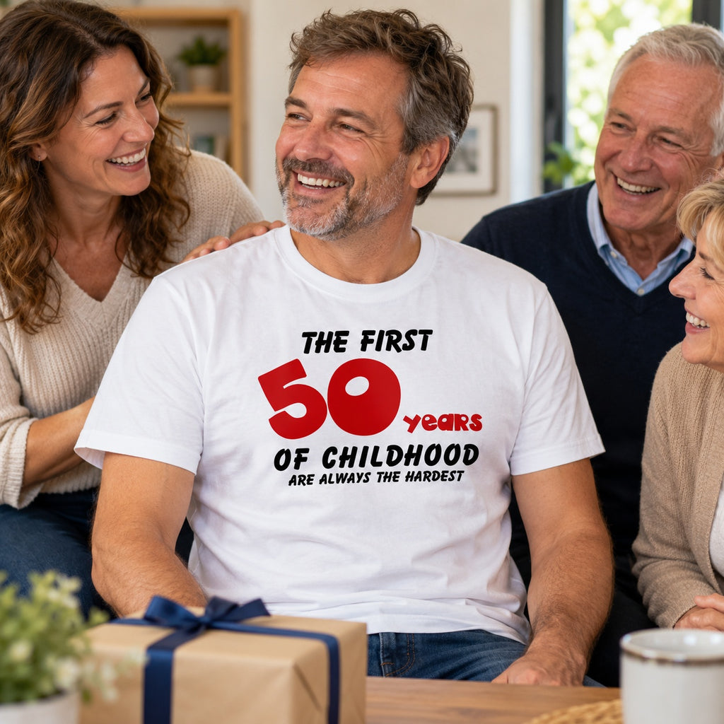 The First 50 Years of Childhood T-shirt in white with a red 50 - laughing man with a birthday present surrounded by family, 50th birthday gift