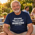 The Best Grandfather In The World wings T-shirt in navy - grandfather relaxing at an evening garden party with friends, milestone birthday gift for grandfather