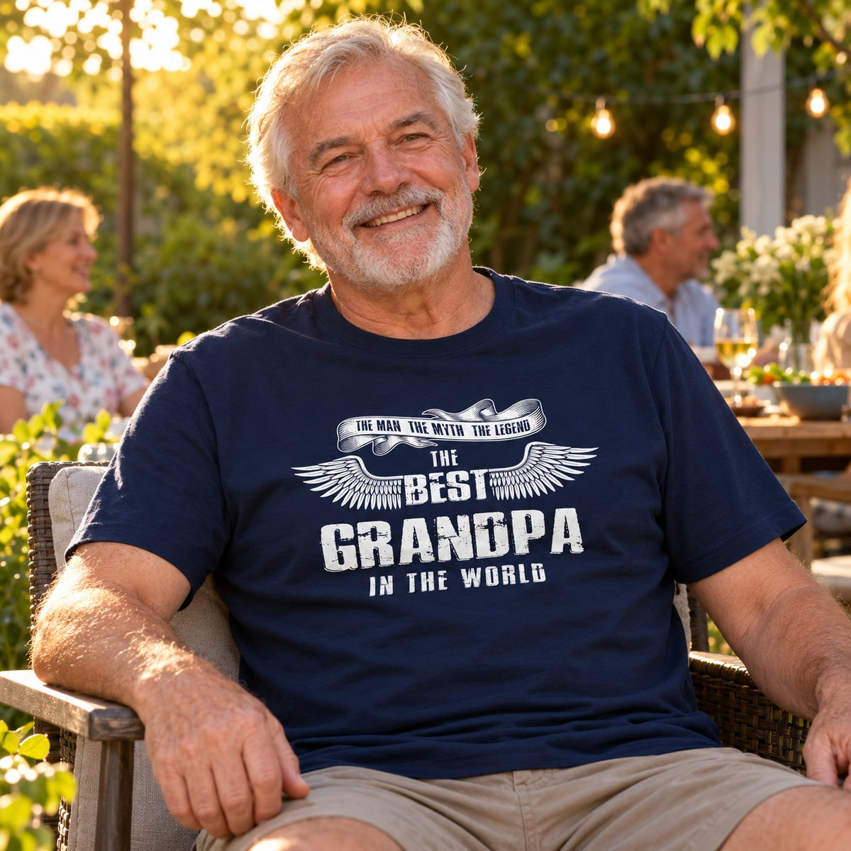 The Best Grandpa In The World wings T-shirt in navy - grandpa relaxing at an evening garden party with friends, gift for grandpa from the grandkids