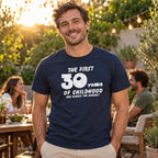 The First 30 Years of Childhood T-shirt in navy - man at an evening garden party with friends, funny 30th birthday shirt