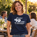 The First 40 Years of Childhood T-shirt in navy - woman at an evening garden party with friends, funny 40th birthday shirt