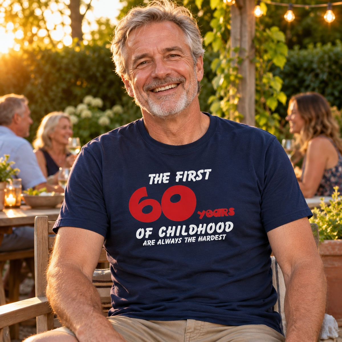The First 60 Years of Childhood T-shirt in navy with a red 60 - smiling man at a garden party at sunset, funny 60th birthday shirt