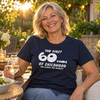 The First 60 Years of Childhood T-shirt in navy - woman at an evening garden party with friends, funny 60th birthday shirt