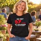 Personalised The First 57 Years of Childhood T-shirt in black - smiling woman at a sunny garden party, any age you choose