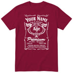 Burgundy unisex T-shirt with personalised Real Queen name and age retro label printed on the front