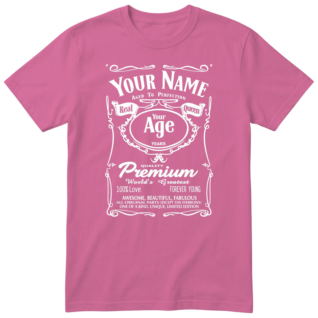 Pink unisex T-shirt with personalised Real Queen name and age retro label printed on the front